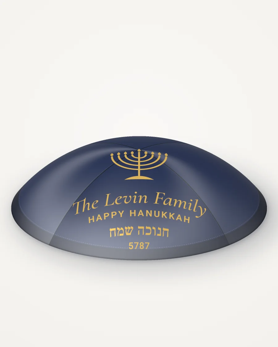 Navy satin kippah, hanukkah menorah design in gold foil with the sample text “The Levin Family”, rendered picture