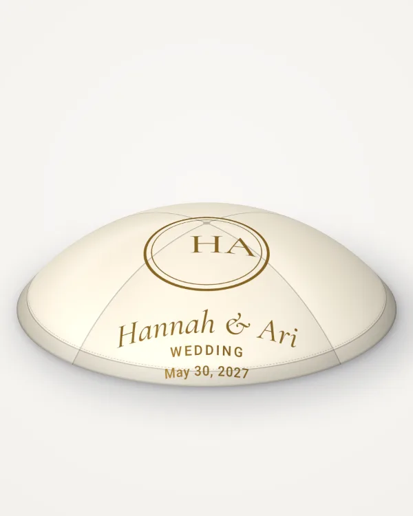 Ivory satin kippah, monogram design in gold foil with the sample text “Hannah & Ari”, rendered picture