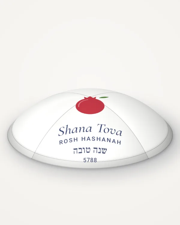 White satin kippah, pomegranate design in full colour with the sample text “Shana Tova”, rendered picture