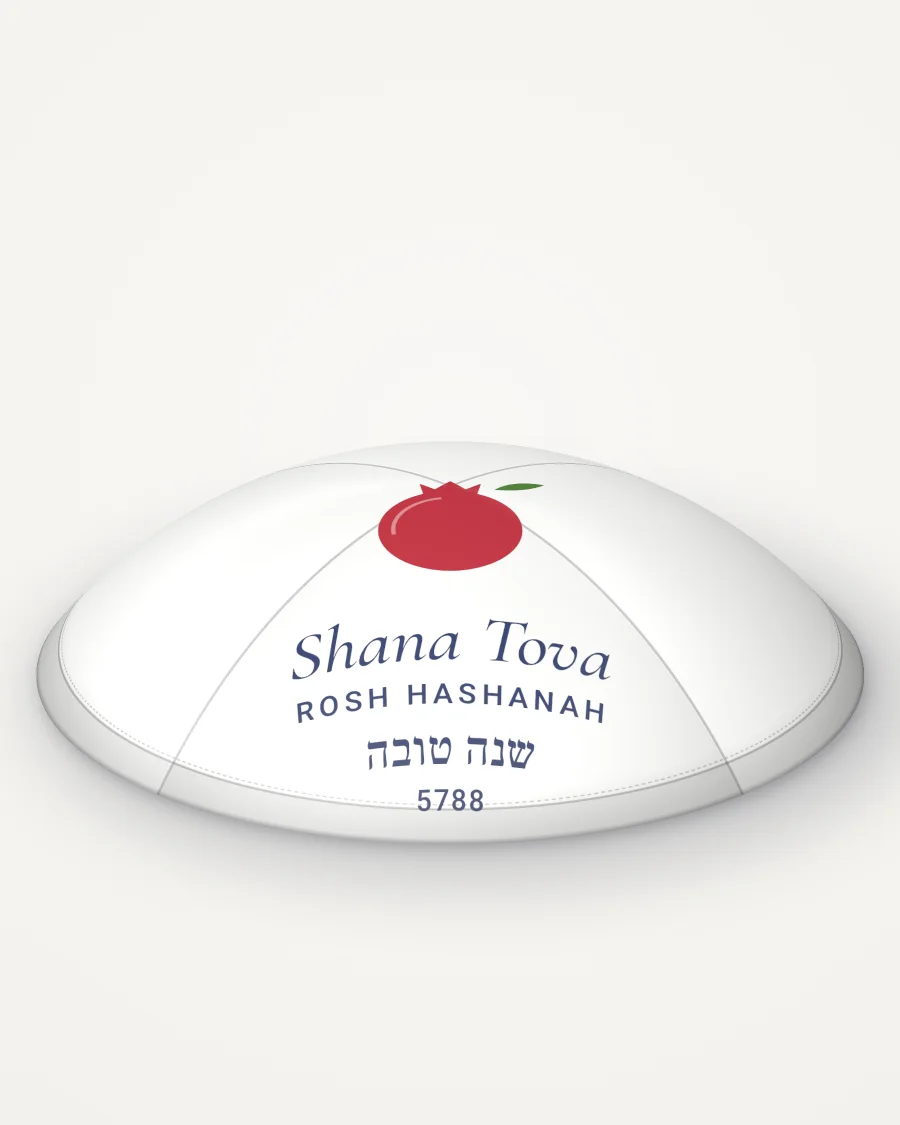White satin kippah, pomegranate design in full colour with the sample text “Shana Tova”, rendered picture
