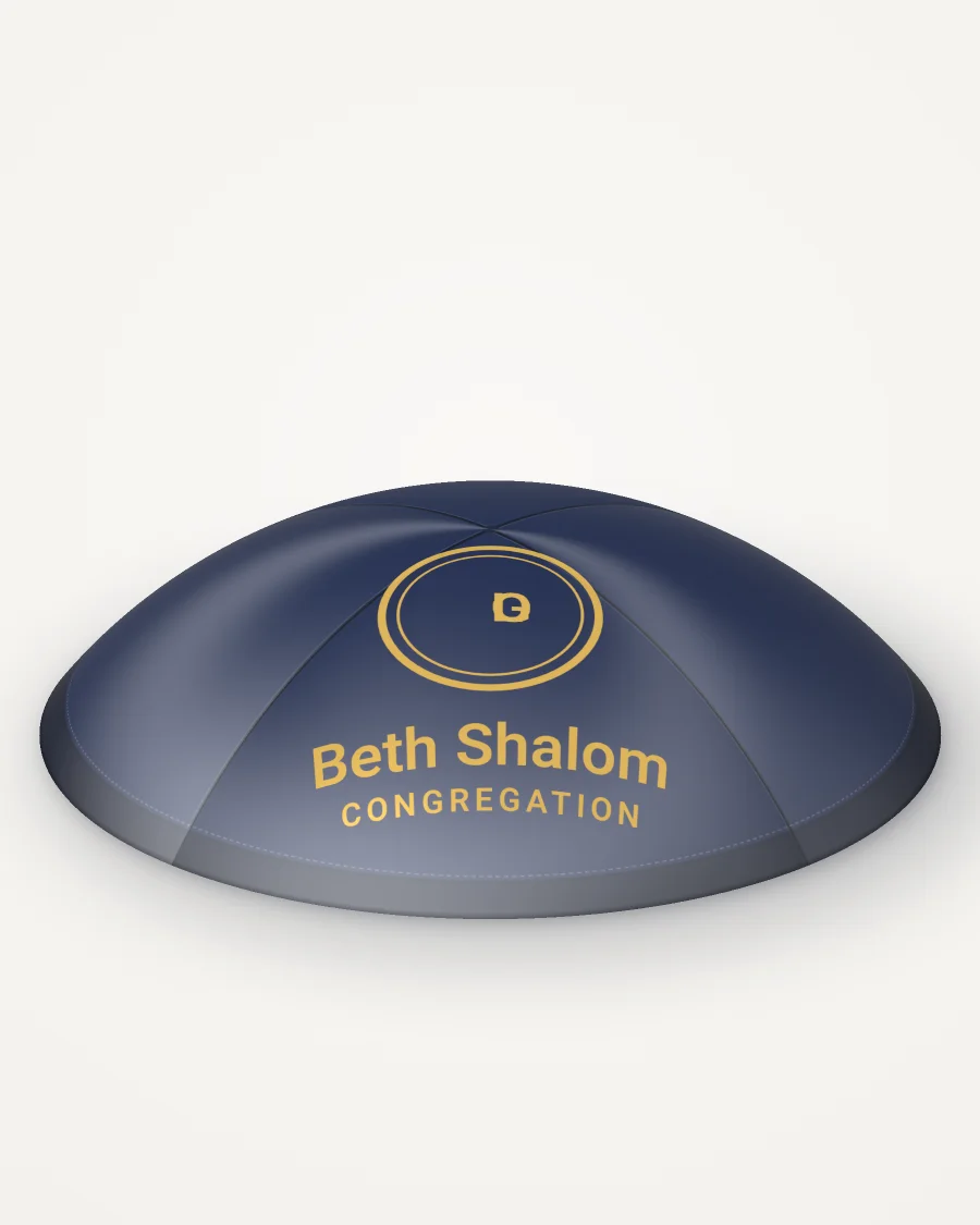 Navy satin kippah, your logo design in gold foil with the sample text “Beth Shalom”, rendered picture